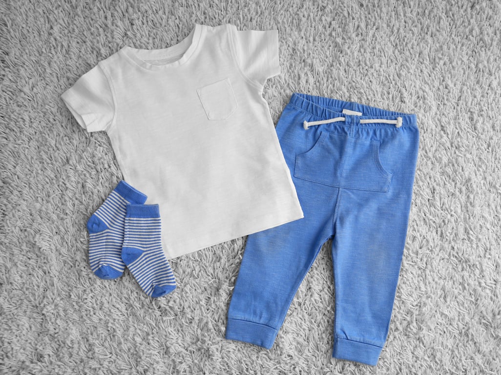 Children's Clothing Flatlay on the Carpet 